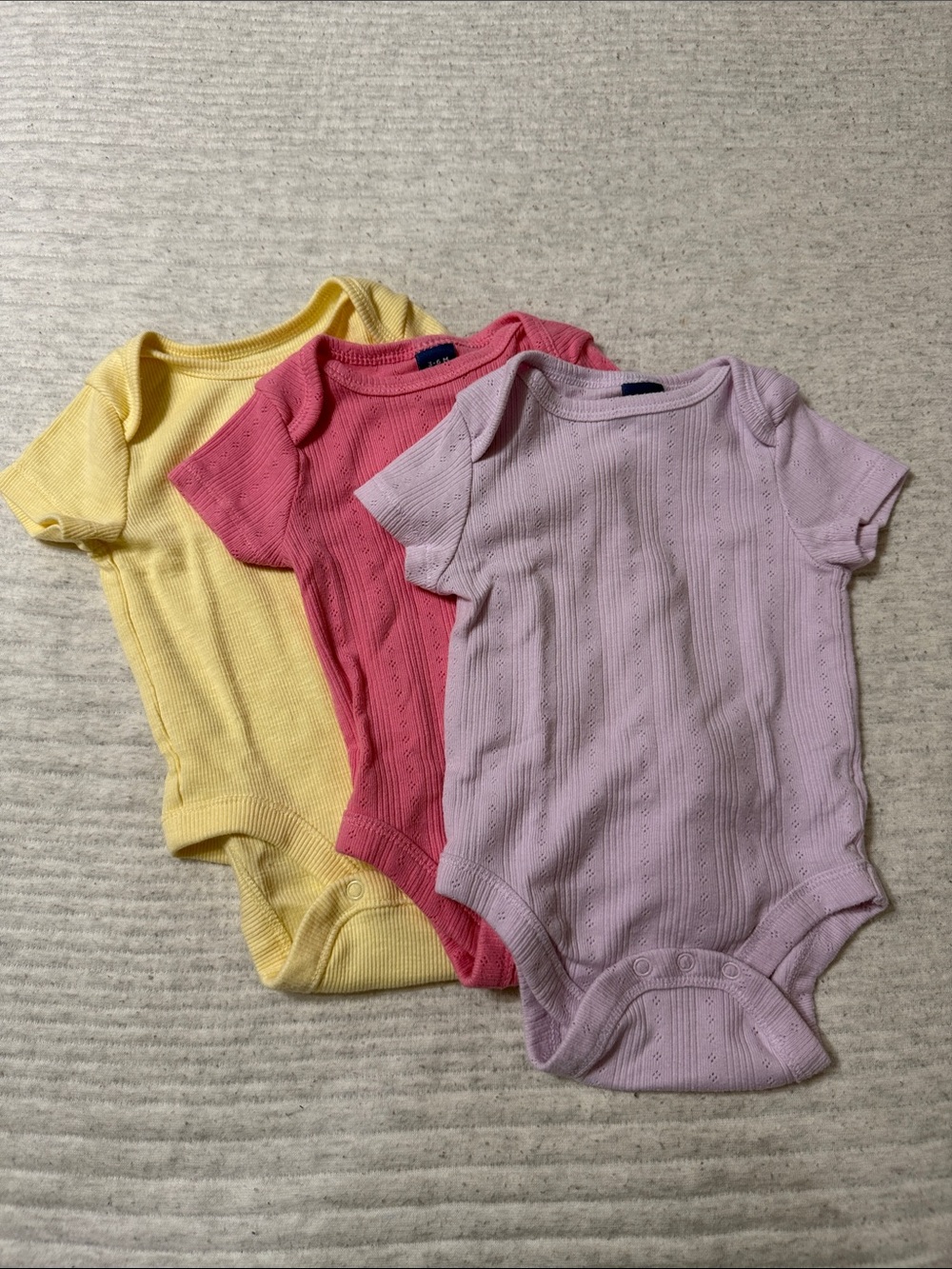 Old Navy Baby Short-Sleeve One-Piece Bodysuit Trio in Yellow, Pink, and Lilac